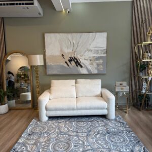 Alfombra Nordica con diseño circular y tonos azules.