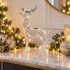 Cerf de Cristal en ambiente navideño