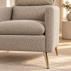 Detalle del tapizado color avellana y pata dorada del Sillón Chaise Noisette