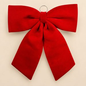 Lazo decorativo rojo Ruby Bow sobre fondo beige